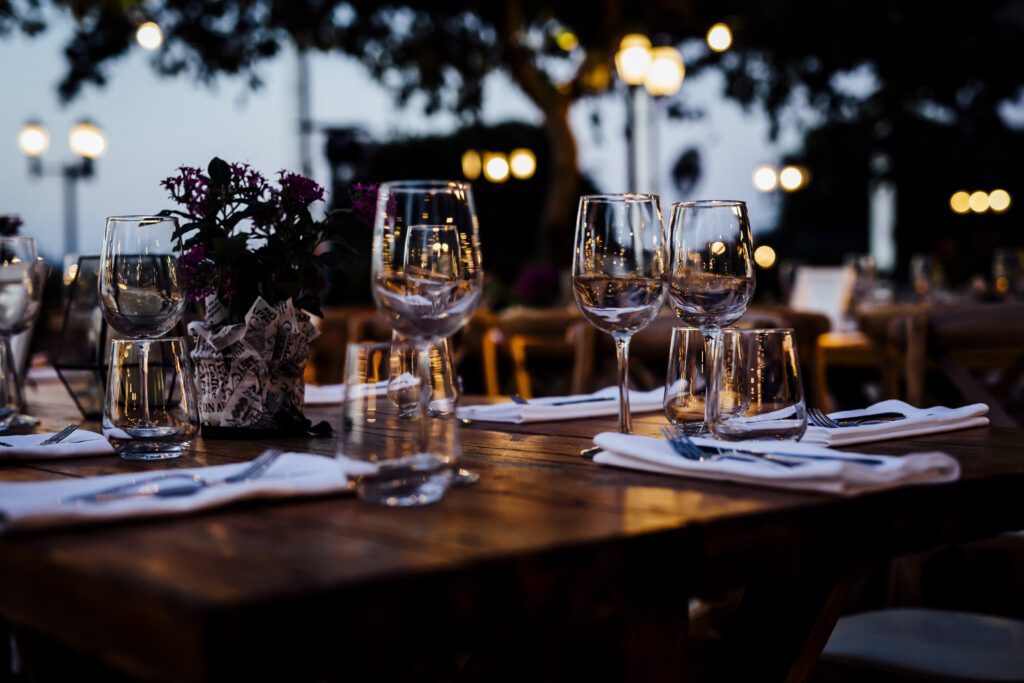 Dining outdoors. A beautiful table setting at dusk