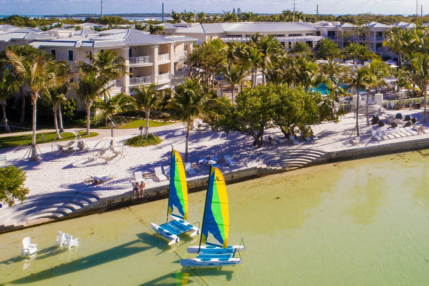 Catamarans on crystal clear water at the Playa Largo Resort Shoreline